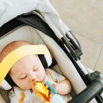 Baby Archie wearing yellow on white BABY earmuffs