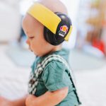Baby Archie wearing yellow on black BABY earmuffs